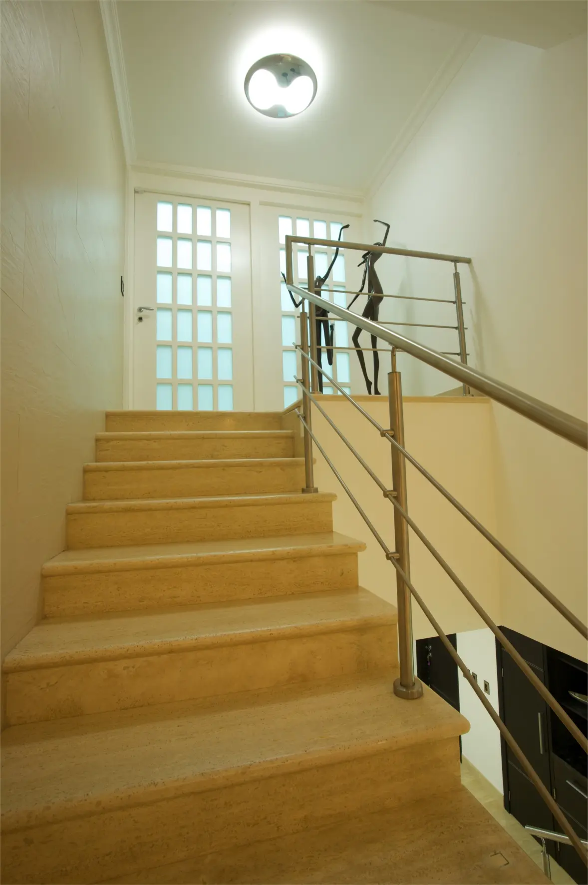 Stairs with sculptures in background
