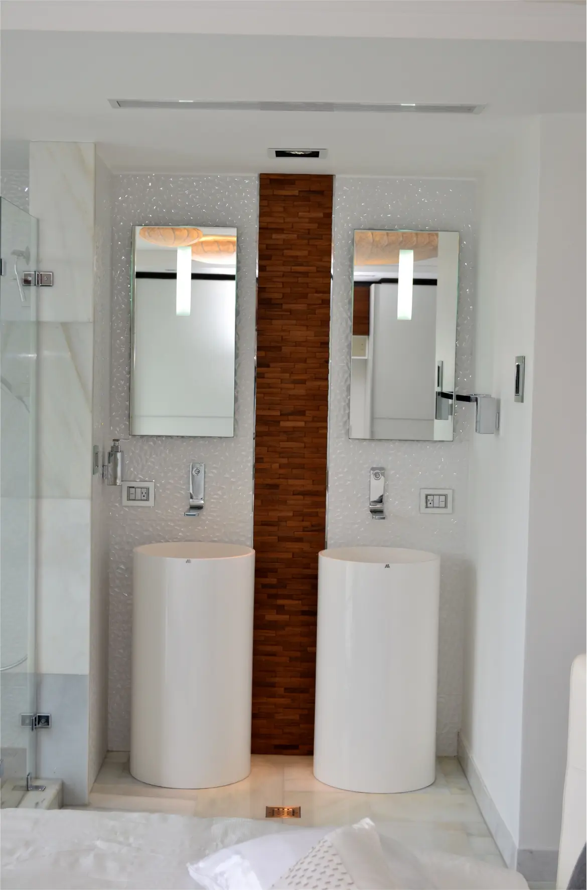 Two sinks with mirrors and wooden details
