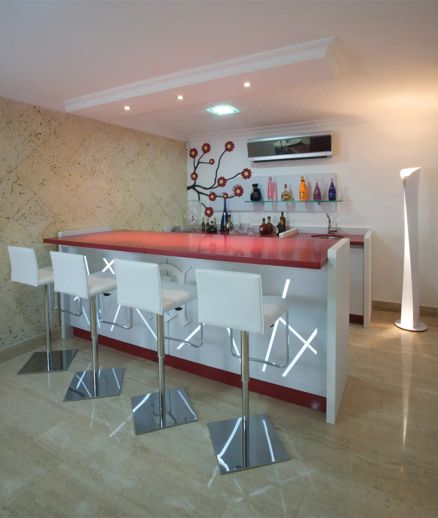 White bar with red top and high chairs