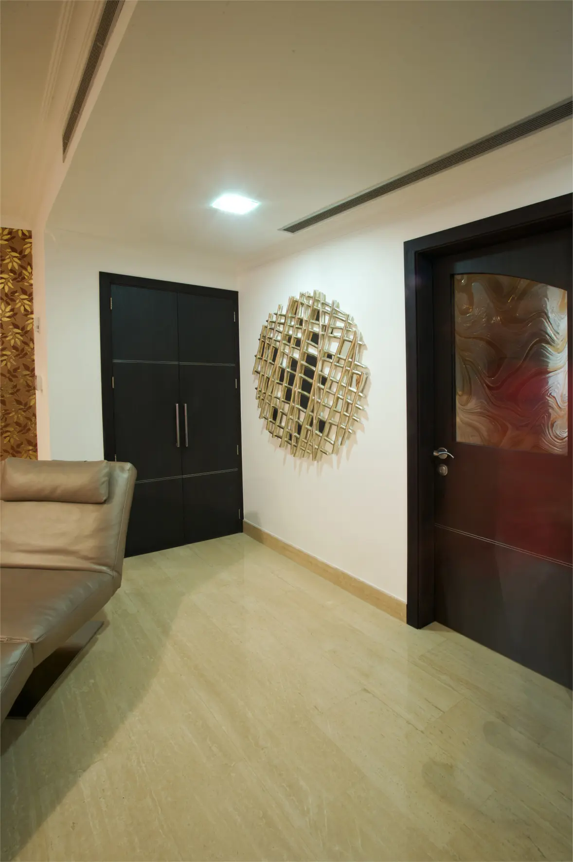 Master bedroom entrance with wall sculpture