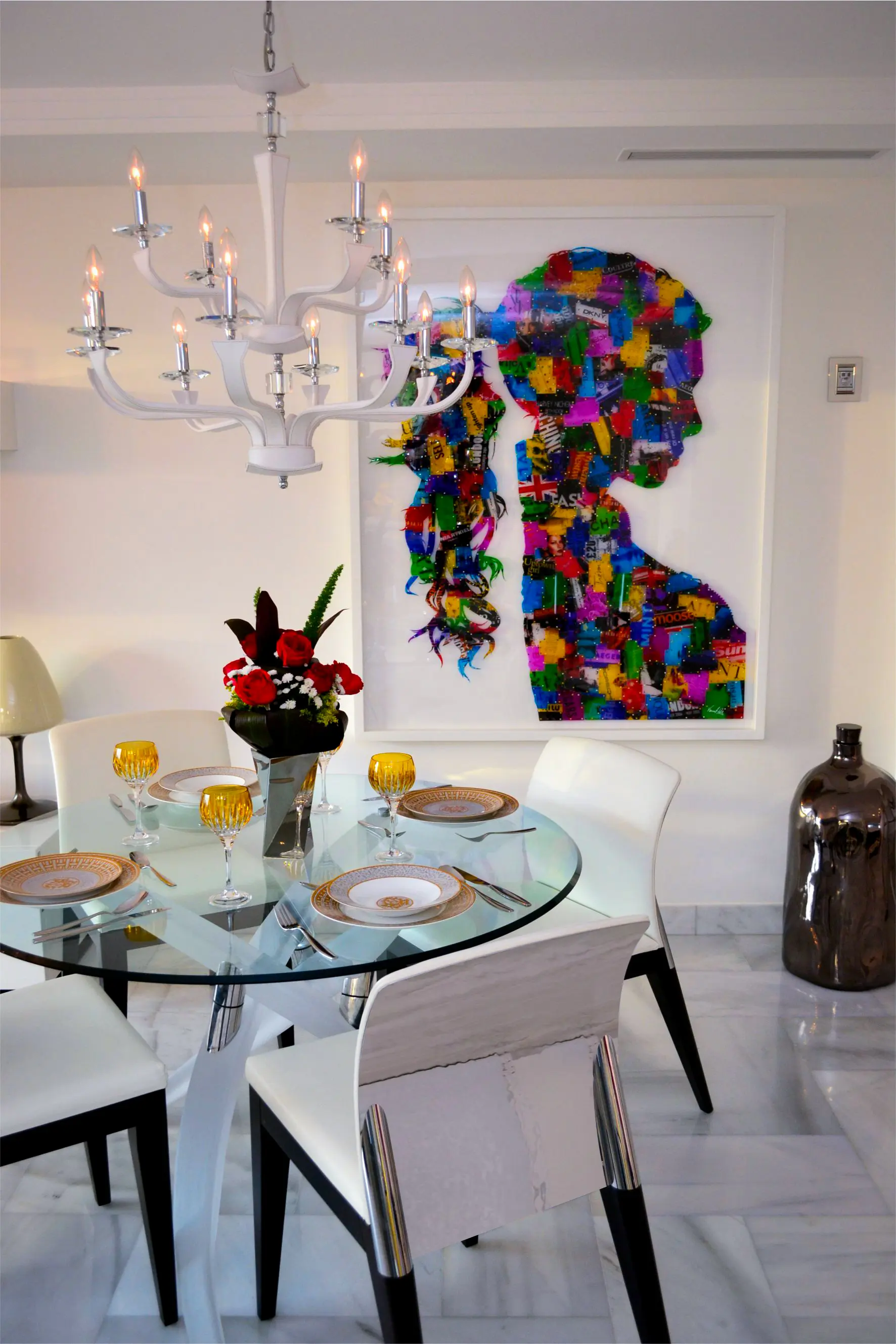 Crystal table with chandelier and painting of multicolor woman