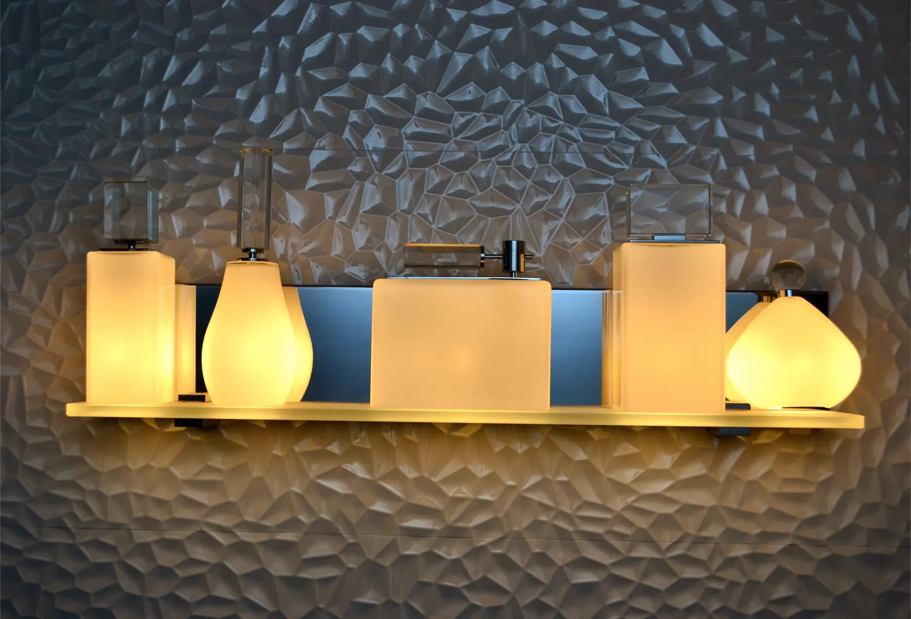 White bathware illuminated by yellow light on dark background