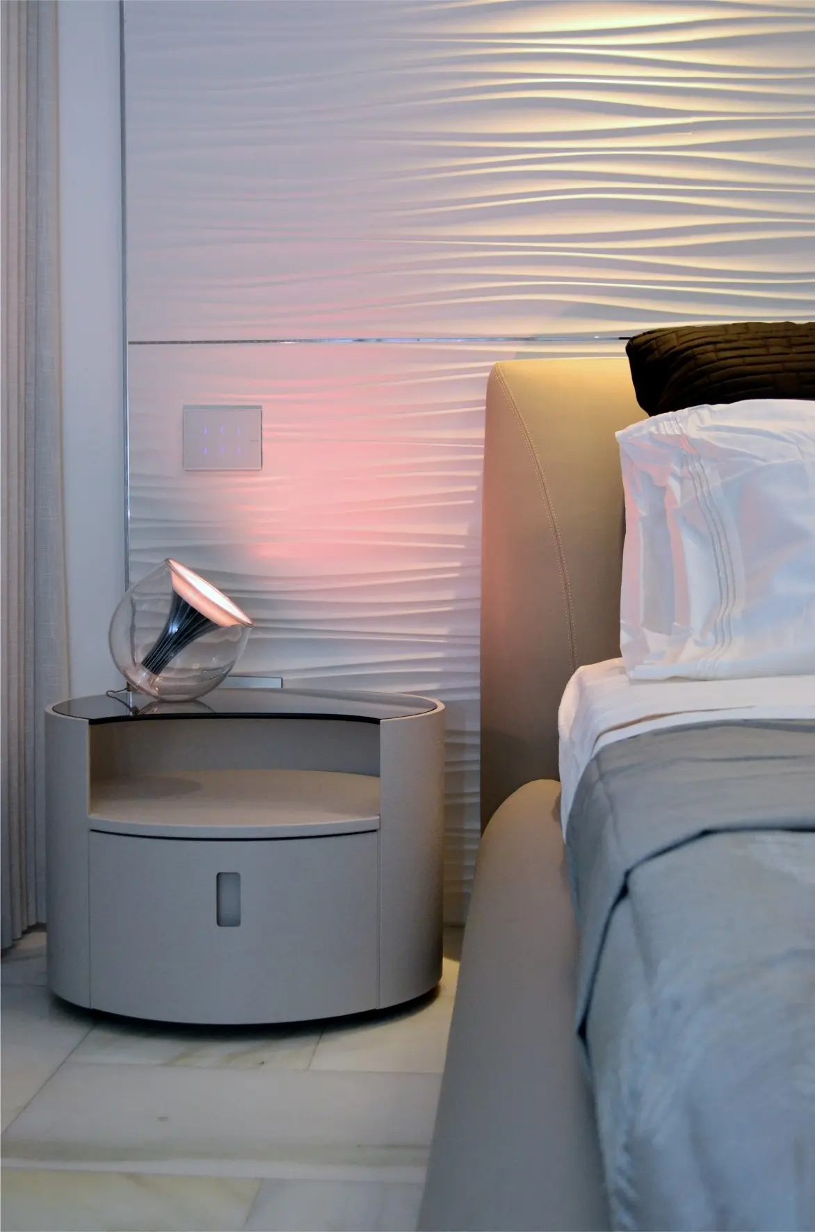 Bed with nightstand and lamp