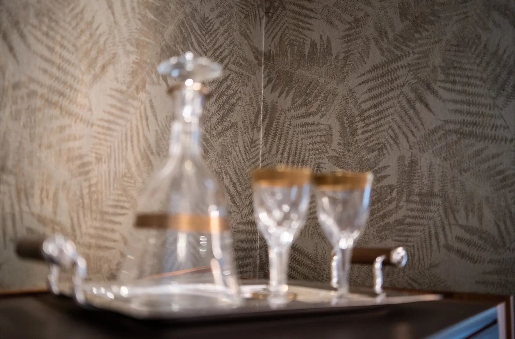 Glassware with leaf print background