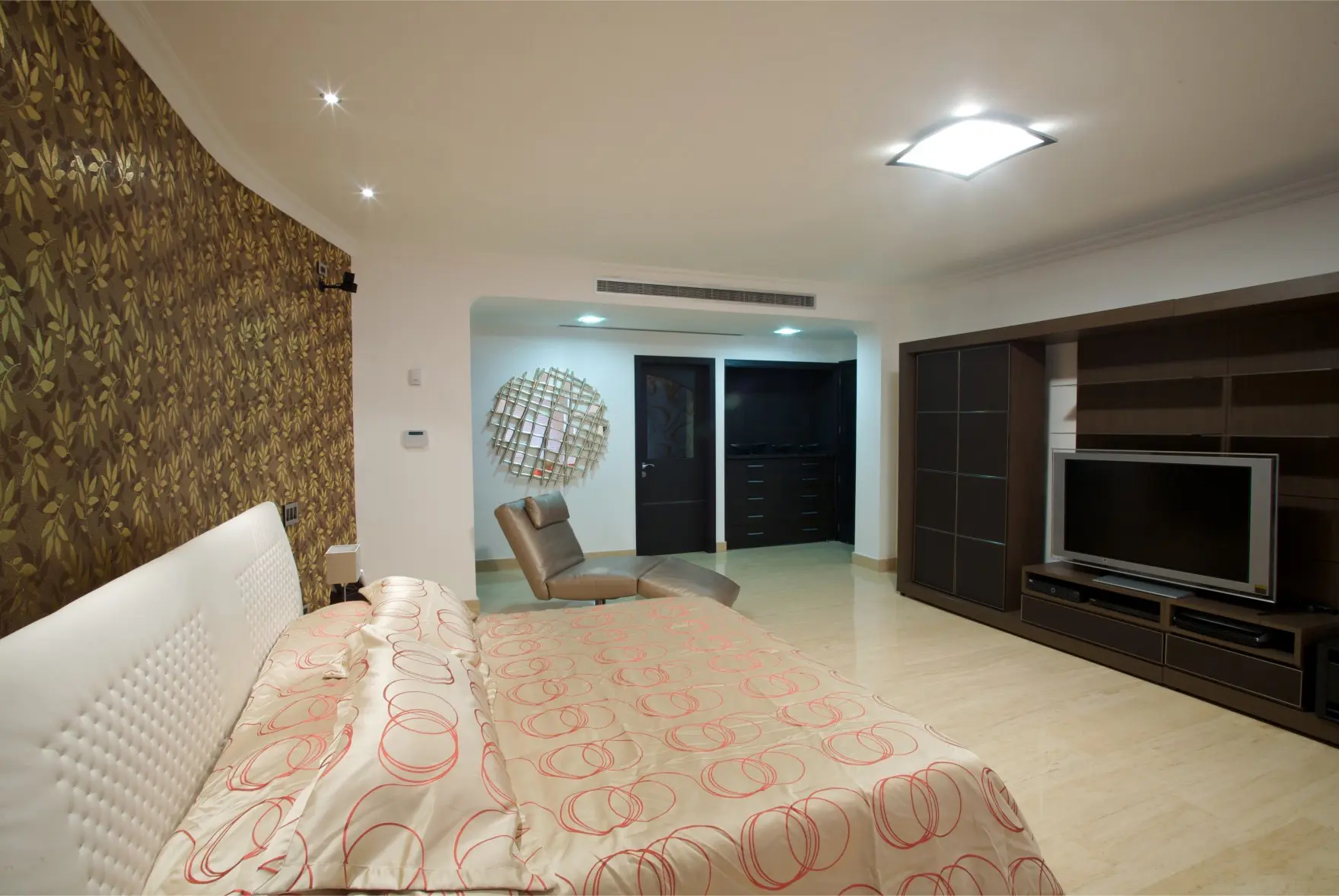 Master bedroom with white bed, golden wall and brown TV cabinet