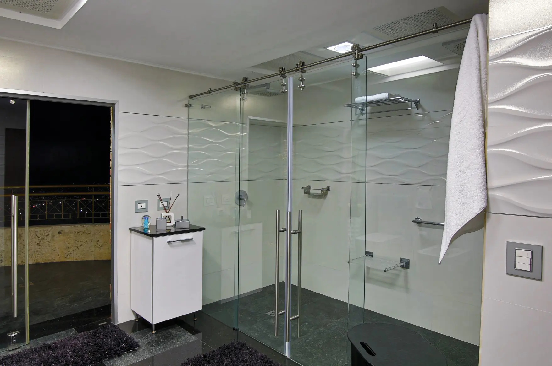 Double shower with crystal door and exit to private terrace