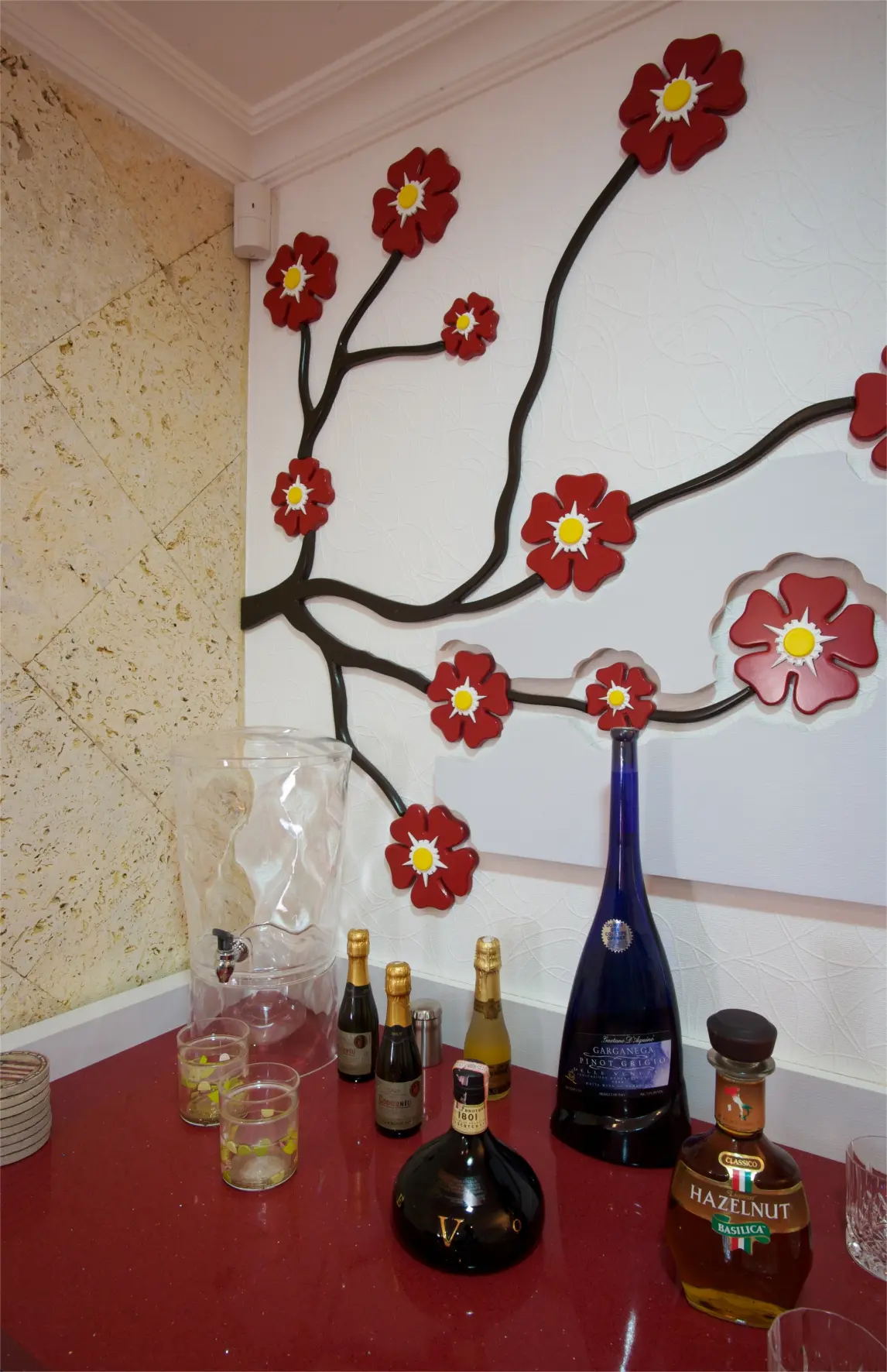 Multiple bottles with flowers wall sculpture