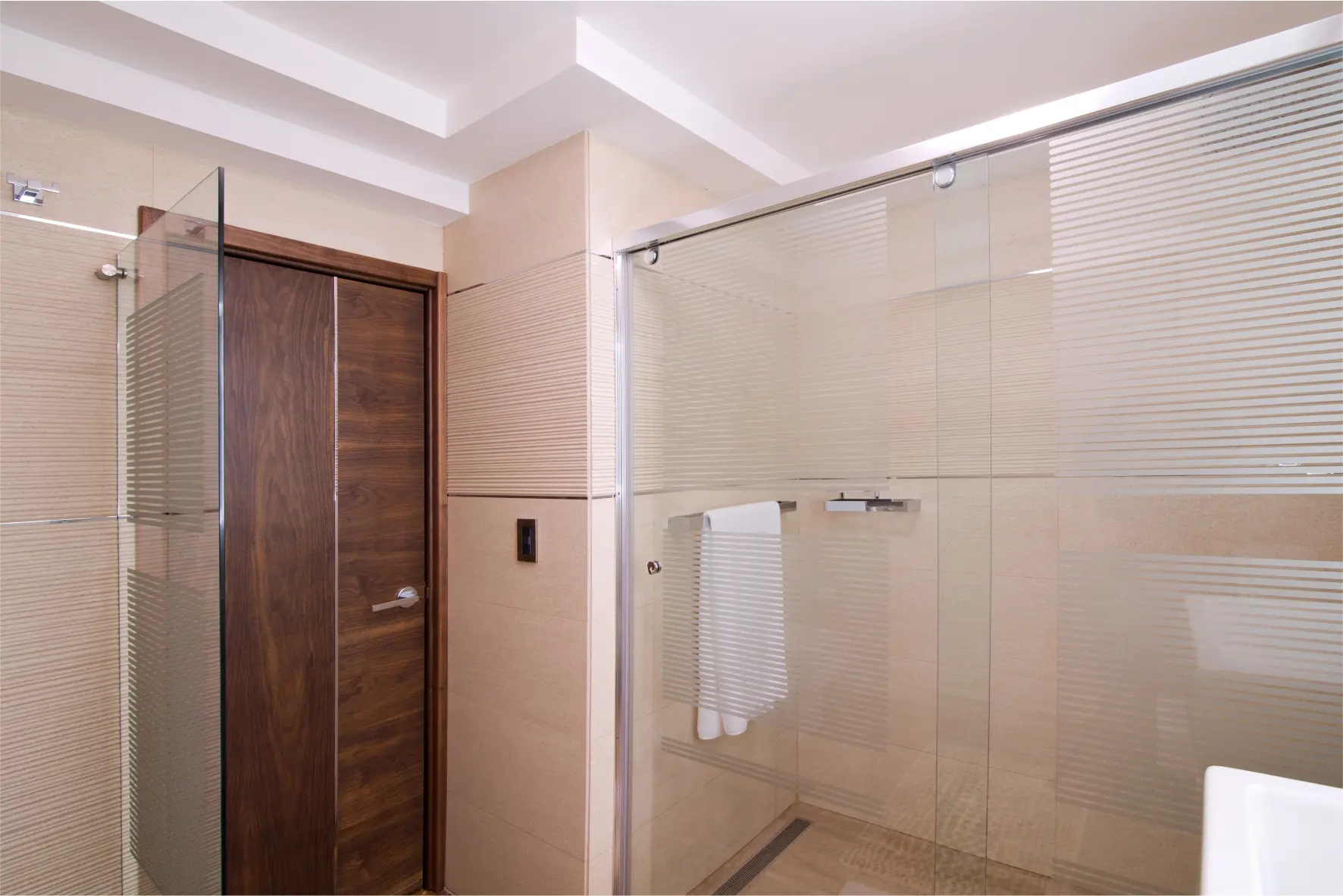 Interior shower view. Brown door