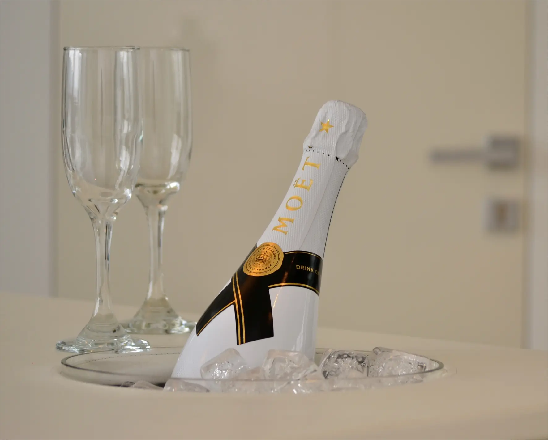 Champagne bottle with glassware