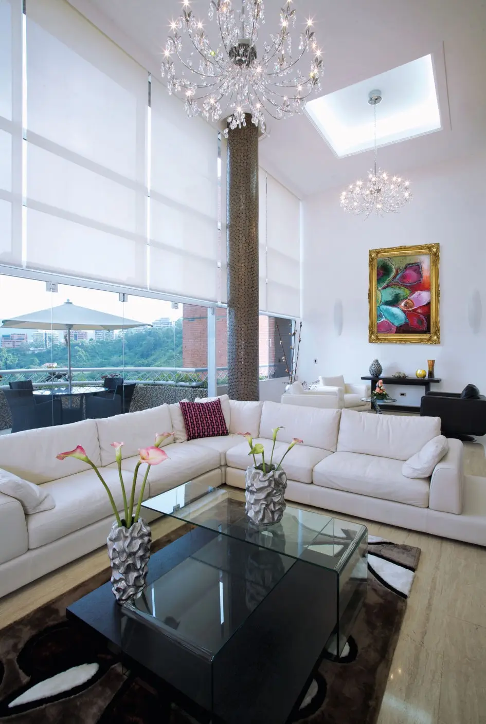 Sofa with black table and painting in background